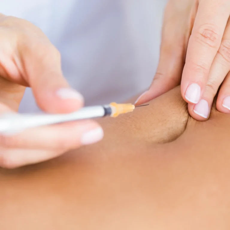 surgeon-making-injection-into-female-body-liposuction-concept